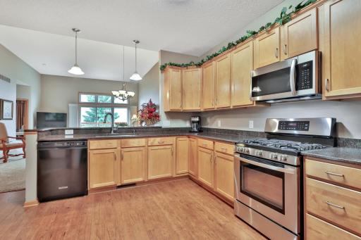 Outlets galore line the counter top from end to end for all your electronic appliances. Great for hosting holiday buffets.
