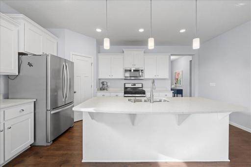 Huge center island in this fantastic kitchen that faces the living room and sunroom