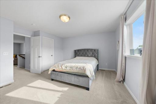 Oversized upper level bedroom with abundant natural light