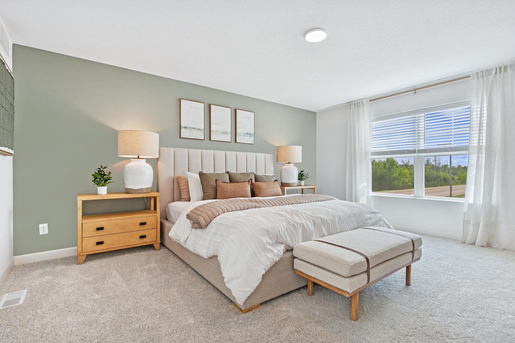 (Photo of model home, features will vary) Nestled on the top floor, the private owner’s suite boasts a spacious bedroom to provide restful nights and a tranquil haven for relaxation, complemented by an en-suite bathroom and large walk-in closet.