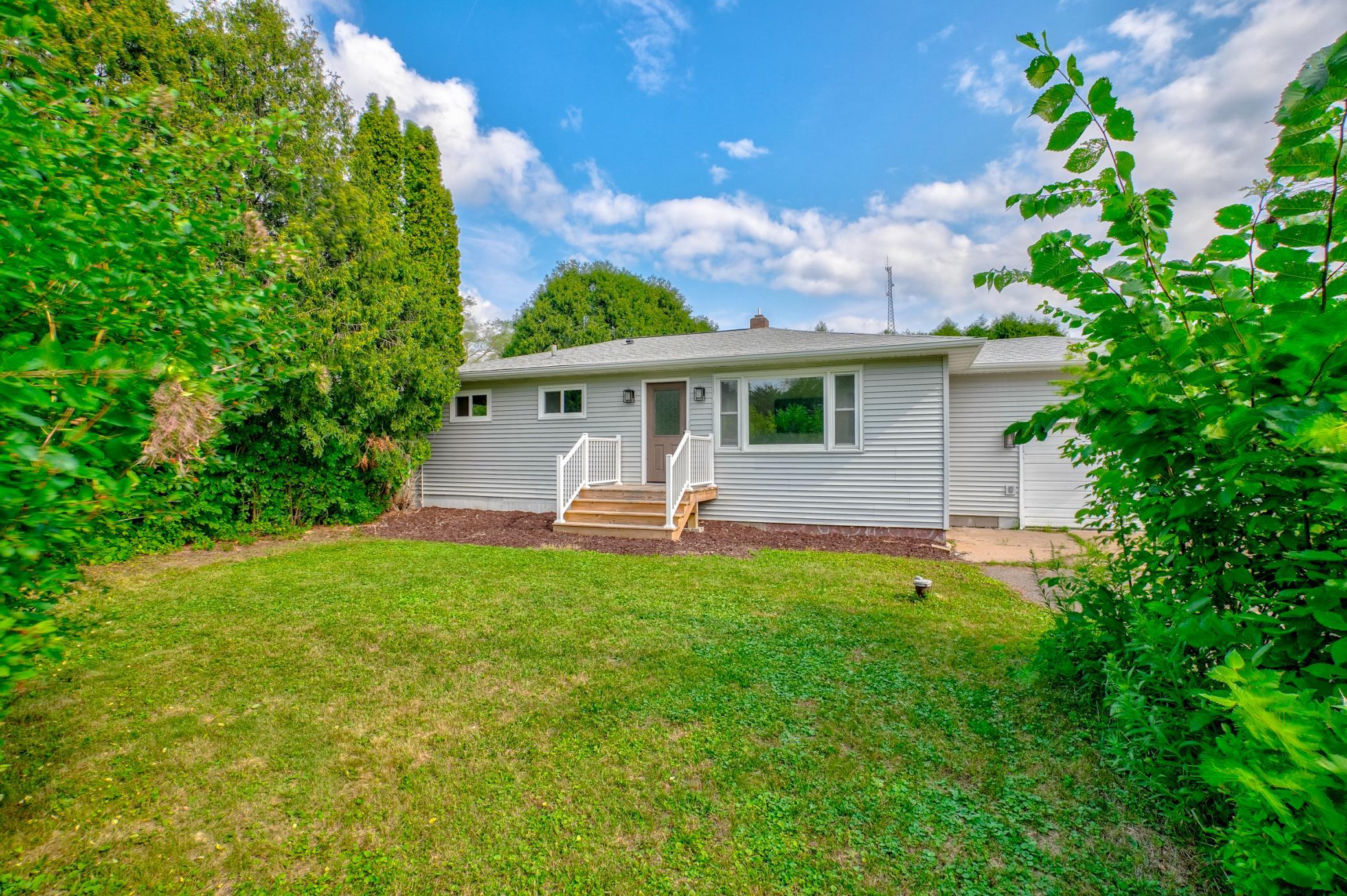 Home features new siding, updated main-level windows, a new front deck, and a new front door, plus a convenient location near the Apple River, parks, restaurants, and Hwy 35 & 64.