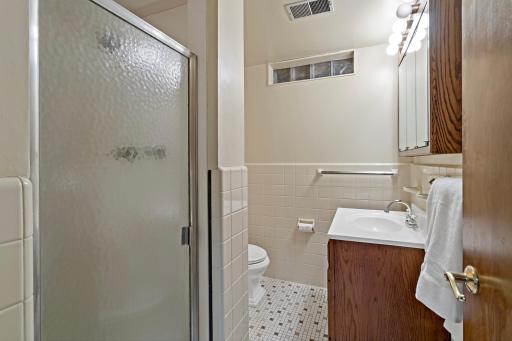 3/4 bathroom conveniently located near the family room, perfect for entertaining and guests.