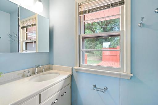 Primary bedroom with a private, attached half bathroom.