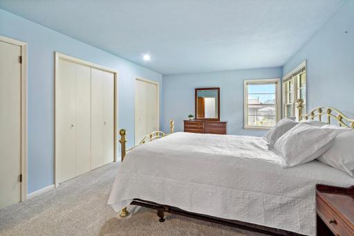 Spacious primary bedroom tucked away from the main living areas, complete with an attached private bathroom for added comfort and convenience.