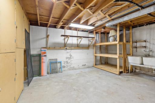 Additional storage room in the back of the garage, perfect for a workshop or extra storage.