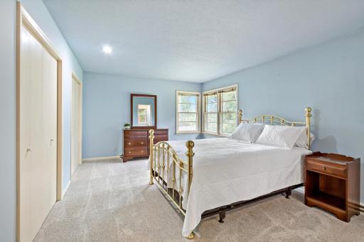 Spacious primary bedroom tucked away from the main living areas, complete with an attached private bathroom for added comfort and convenience.