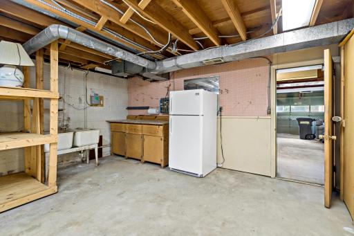 Additional storage room in the back of the garage, perfect for a workshop or extra storage.