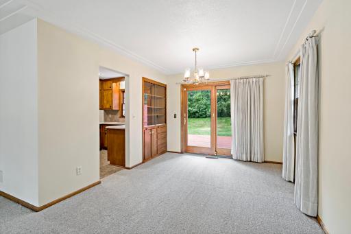 Separate dining room conveniently located near the kitchen, with a sliding door leading to a private deck and backyard—perfect for indoor-outdoor entertaining.