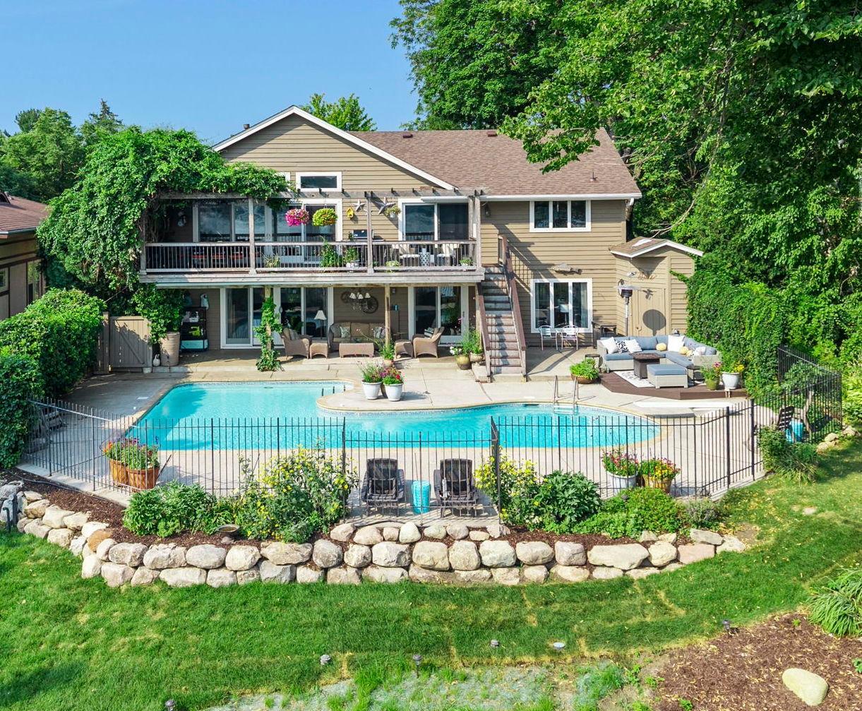 Resort style backyard with pool and deck areas.jpg