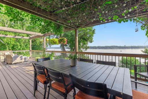 Large upper deck accomodates a dinning table and seating area.jpg