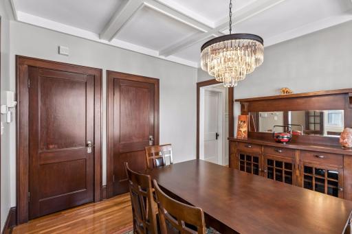 The large dining room in the center of the home features a boxed & beamed ceiling and a classic built-in buffet.