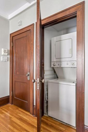 In-unit laundry is conveniently located in a closet nearby.