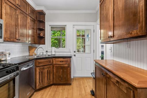 Rear door leads out to a sunny, west-facing screened porch.
