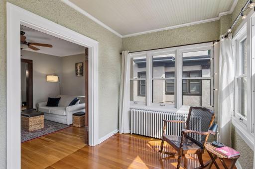 This sunroom has windows facing north, south & east and is ideal for a home office or a getaway reading spot.