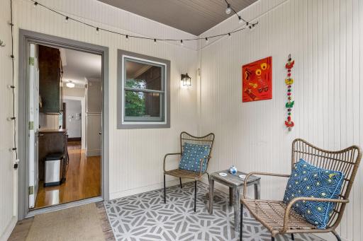 Rear door leads out to a sunny, west-facing screened porch.