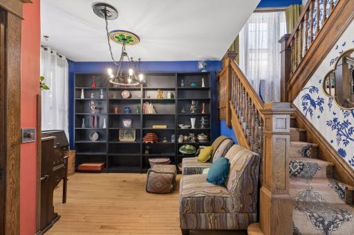 The cozy parlor is located to the left of the front entrance