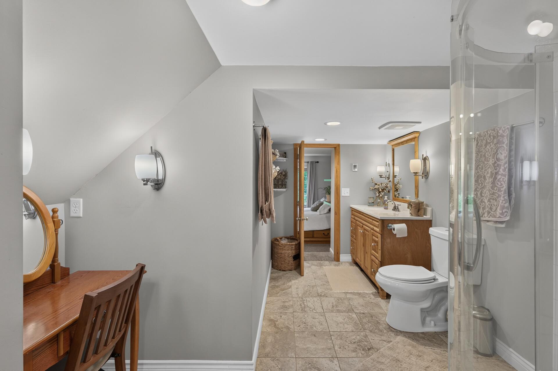 Lower level: primary bedroom with bathroom ensuite and fireplace