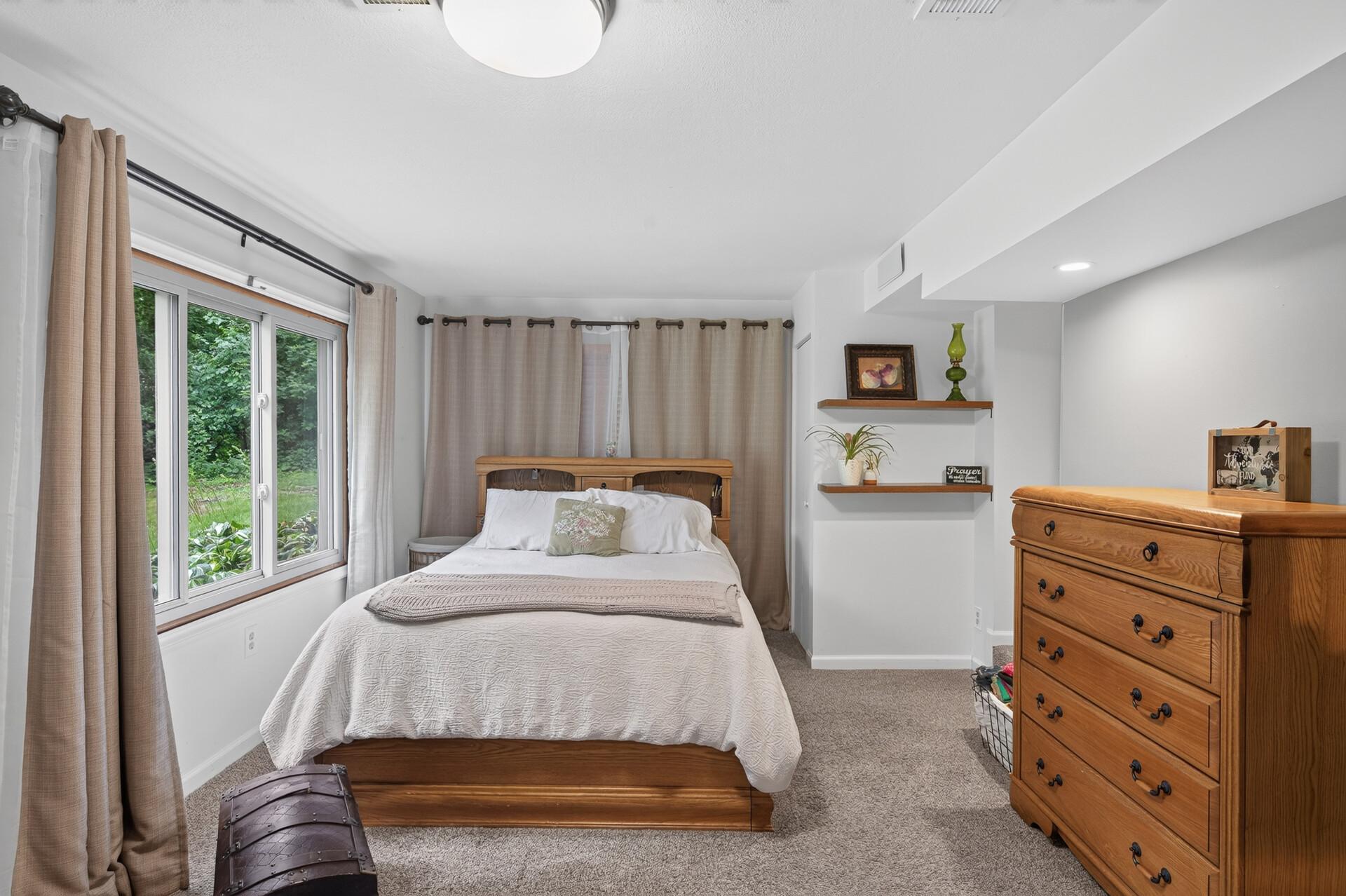 Lower level: primary bedroom with bathroom ensuite and fireplace