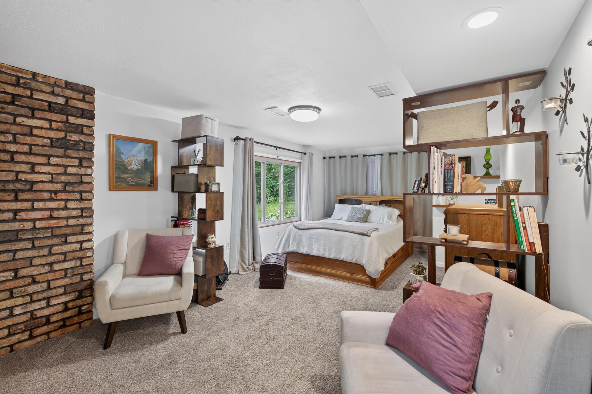 Lower level: primary bedroom with bathroom ensuite and fireplace