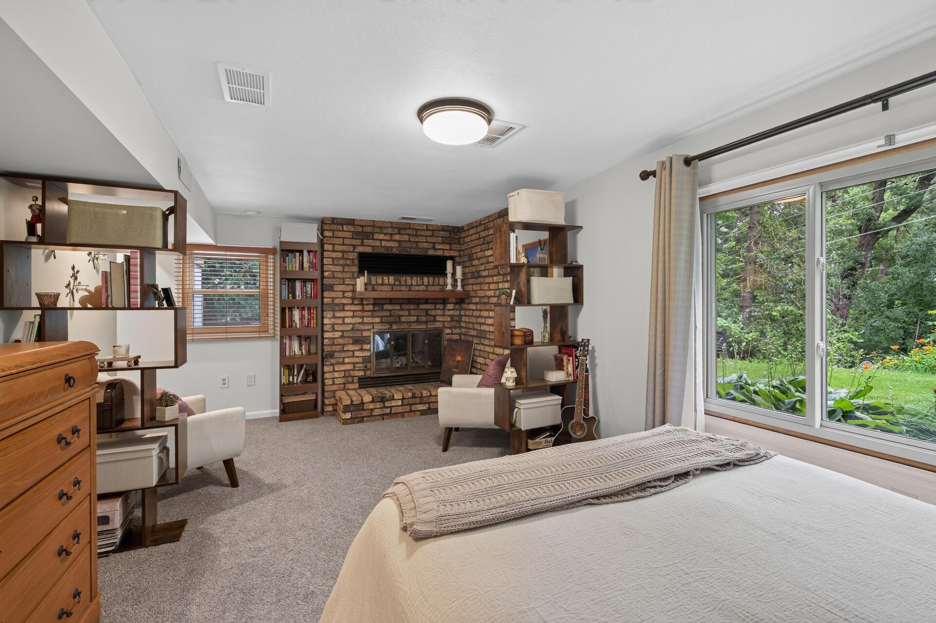 Lower level: primary bedroom with bathroom ensuite and fireplace