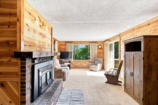 Living Room with fireplace and access to rear deck