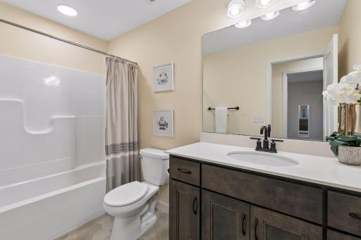 Conveniently located on the upper level, this full bathroom offers a clean, timeless design and easy access from the secondary bedrooms.