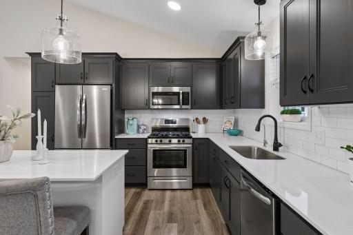 With abundant cabinetry, generous counter space, and a smart layout, this kitchen offers the storage and functionality every home chef will appreciate.