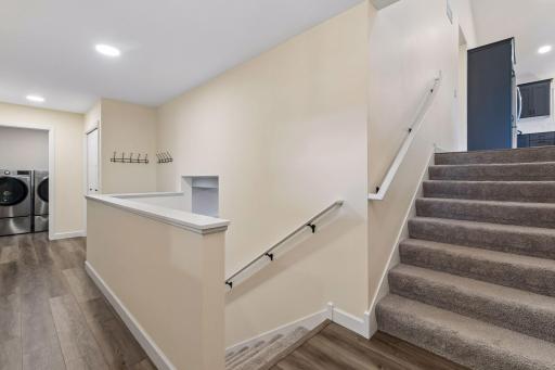 Step inside to a welcoming entry designed for everyday living. With a convenient drop zone, garage access, coat closet, and nearby laundry room, this thoughtfully designed space helps keep everyday essentials organized.