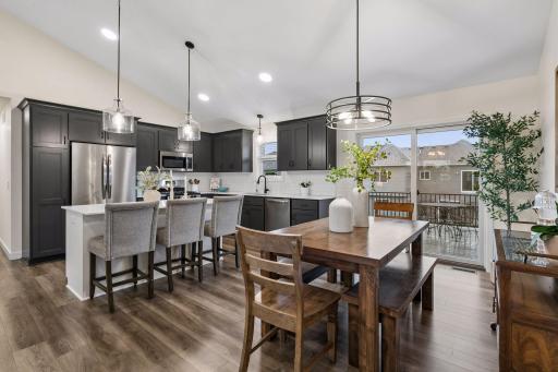 Where memories are made. Gather around the island, share meals in the dining area, or step outside to the deck—all in one open, inviting space.