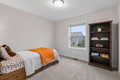 Bright and comfortable, this second upper-level bedroom offers flexibility for family, guests, or a home office.