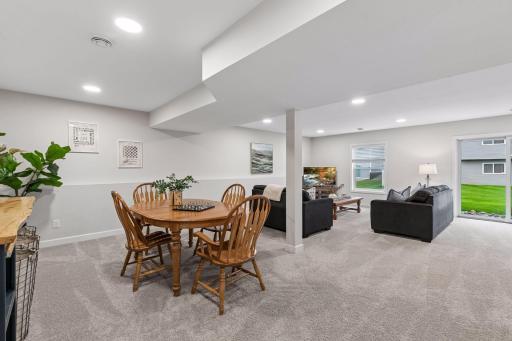 Movie nights, game days, and gatherings are easy in this spacious lower level family room, offering endless possibilities for entertaining, relaxing, or creating the perfect hangout space.