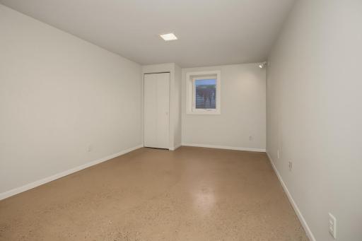Lower level bedroom with egress window.