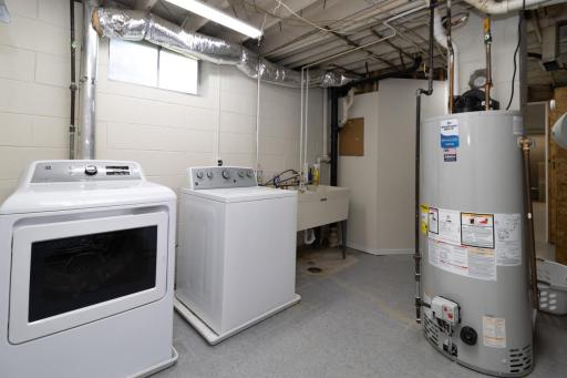 Laundry room with funtional laundry shoot (you can see it in the upper right hand corner). New water heater 2026.