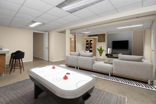 Virtually staged lower level rec room.
