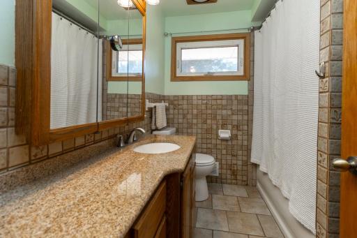 Updated bathroom with deep soaking tub.