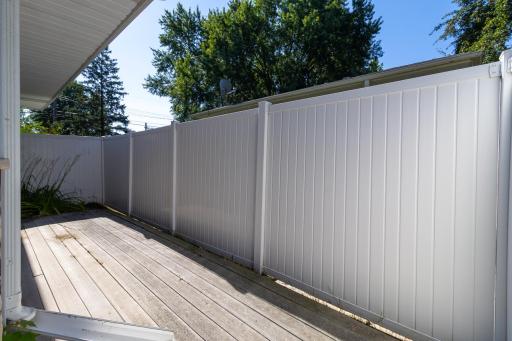 Private outdoor storage off the garage for garbage cans and such.