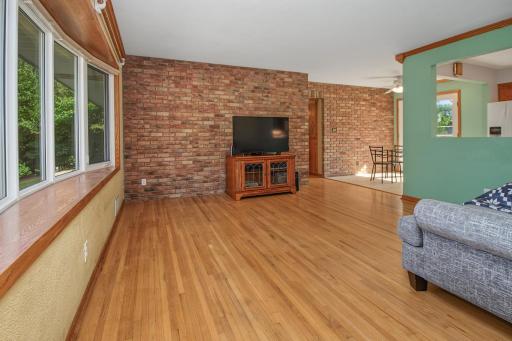 Bay window overlooks the front yard. Original hardwood floors thoughout main level, kitchen/dining room have luxury vilyn tile.