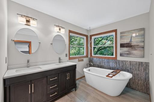Spacious Primary Suite featuring two walk-in closets and a private en suite bath.