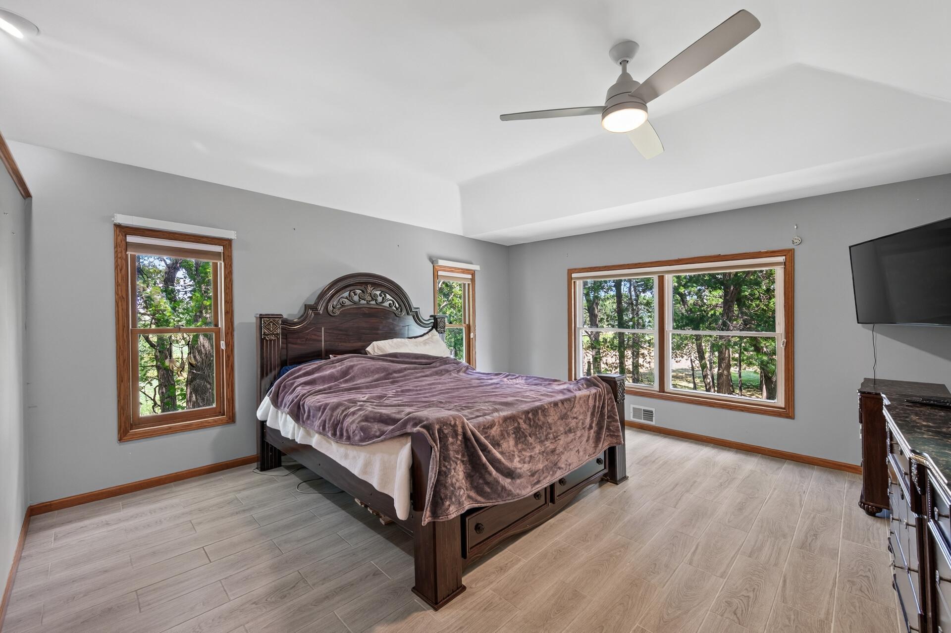 Spacious Primary Suite featuring two walk-in closets and a private en suite bath.