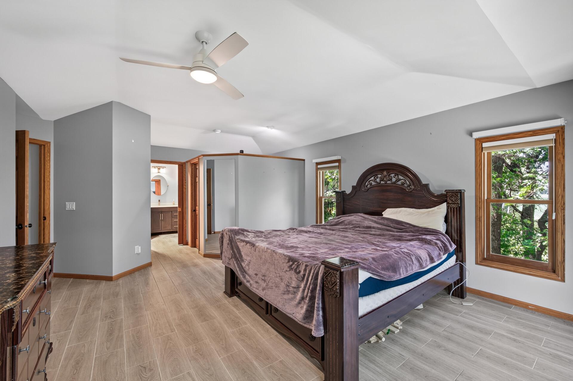 Spacious Primary Suite featuring two walk-in closets and a private en suite bath.