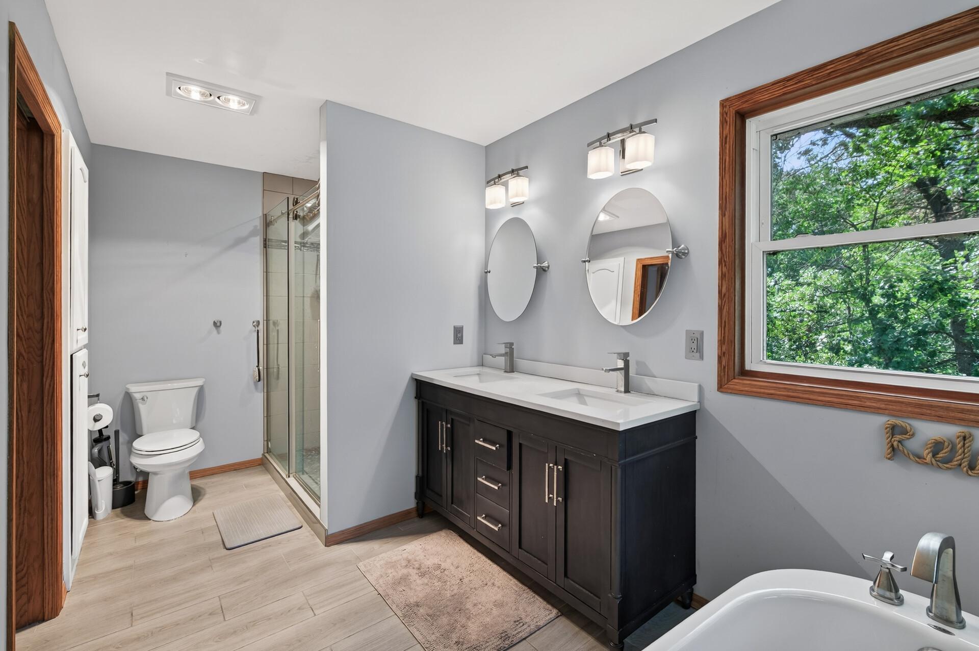 Spacious Primary Suite featuring two walk-in closets and a private en suite bath.