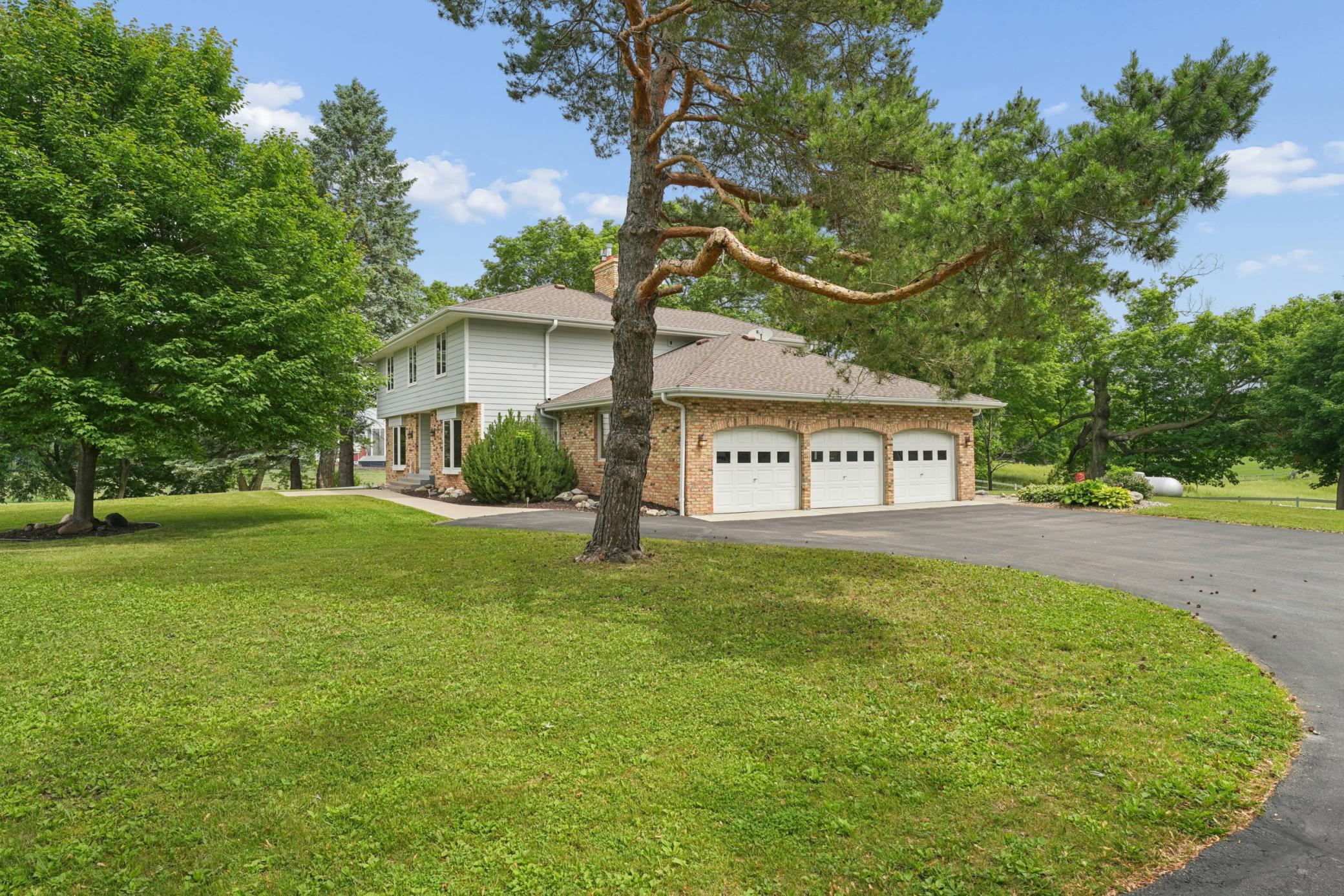 Welcome home—this beautifully maintained property offers privacy, space, and timeless curb appeal.