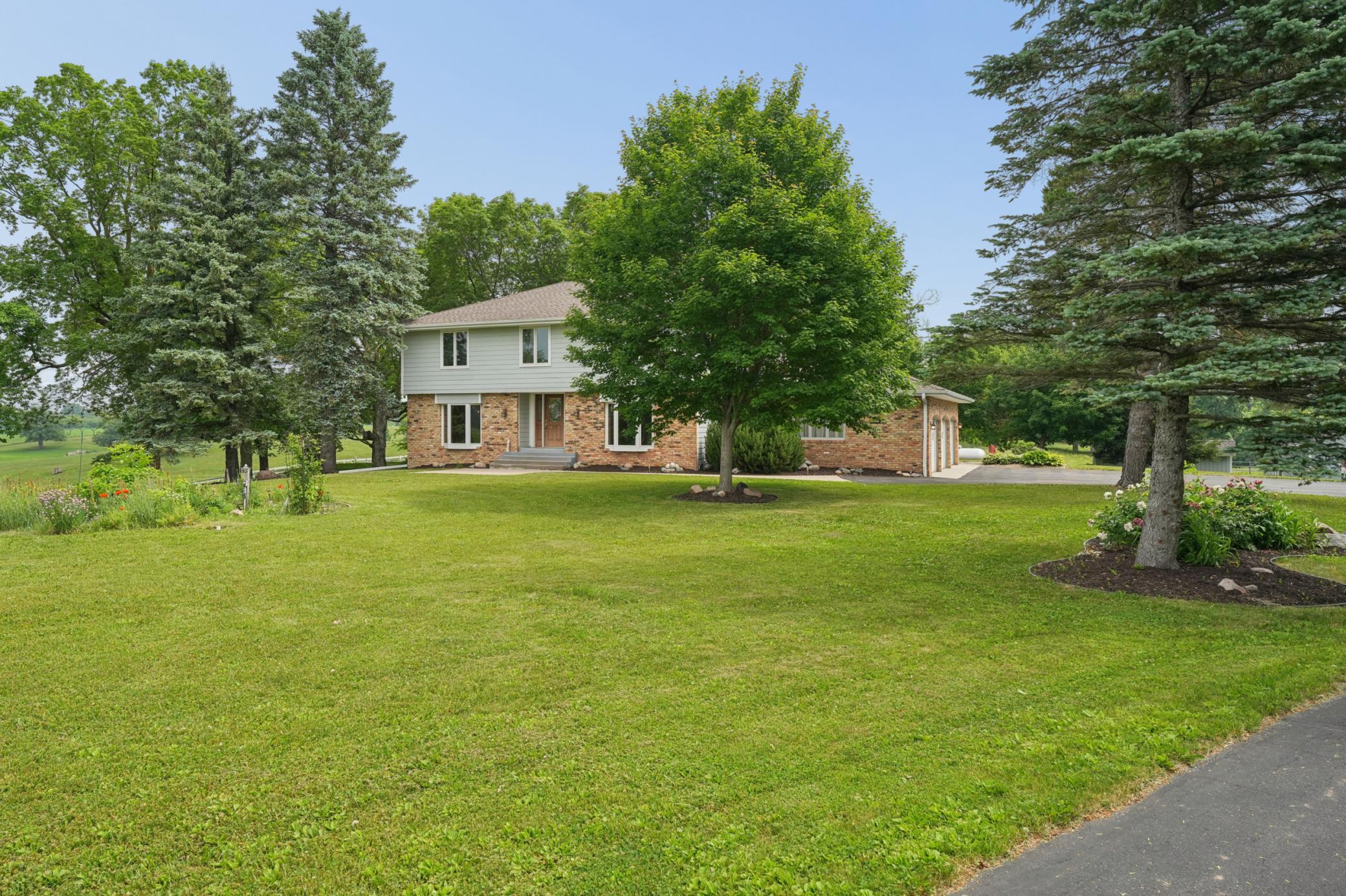 Welcome home—this beautifully maintained property offers privacy, space, and timeless curb appeal.