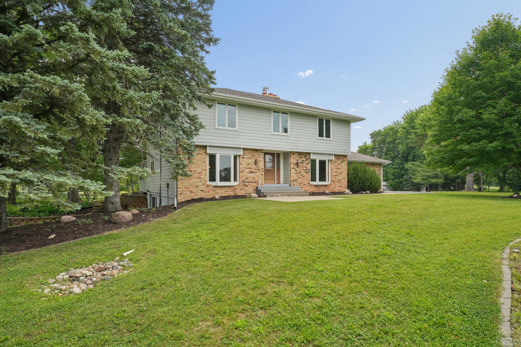 Welcome home—this beautifully maintained property offers privacy, space, and timeless curb appeal.
