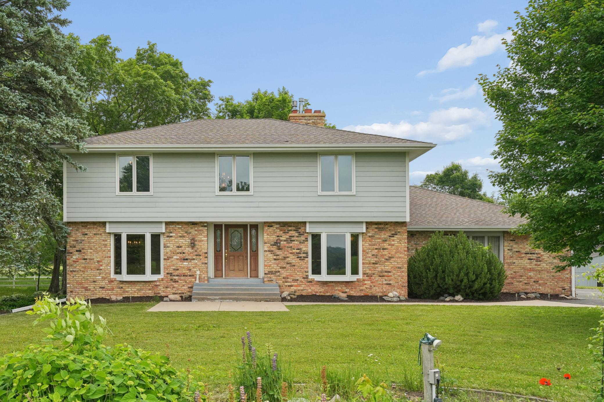 Welcome home—this beautifully maintained property offers privacy, space, and timeless curb appeal.