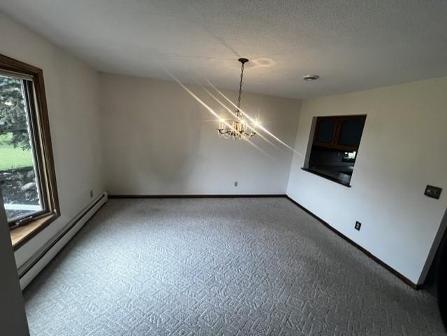 Dining Room with Bay Window and Pass Through to Kitchen.jpg