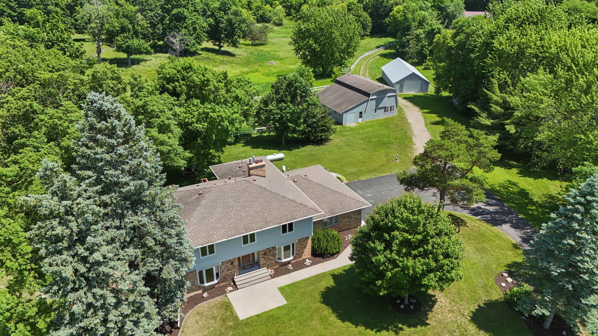 Private and picturesque nearly 10 acre estate with additional buildable parcel—an exceptional Minnetrista opportunity.