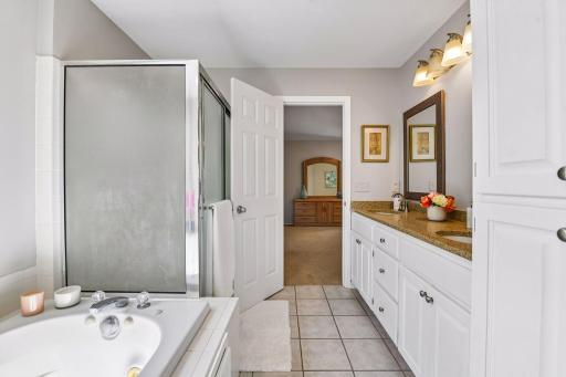 Primary bath with double vanity, jetted tub, separate shower and private water closet.