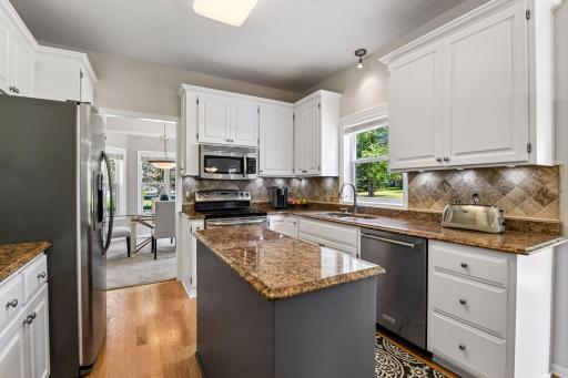Enjoy entertaining in this kitchen boasting stainless steel appliances, granite countertops and window looking out to the backyard.