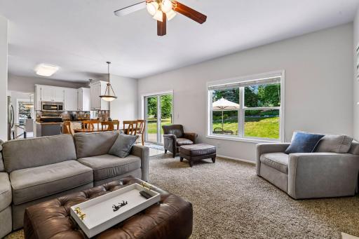 This view highlights the open-concept main level, allowing the kitchen to flow seamlessly into the family room so everyone can stay connected while cooking, entertaining, or relaxing.